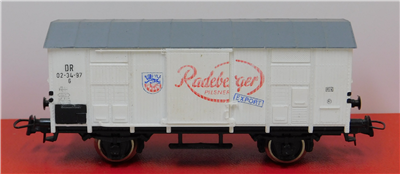 57087b